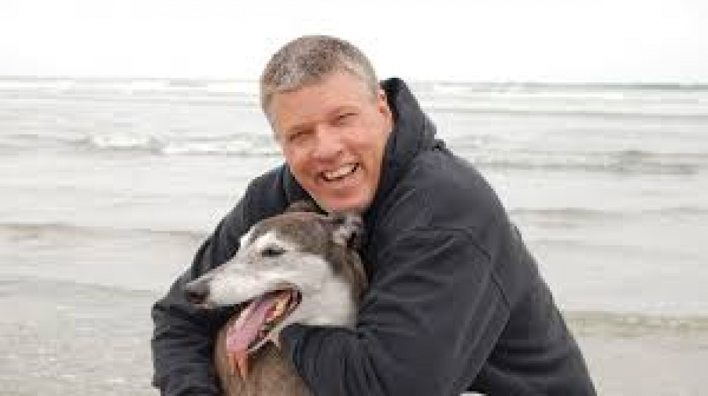 Man With Dog on Beach